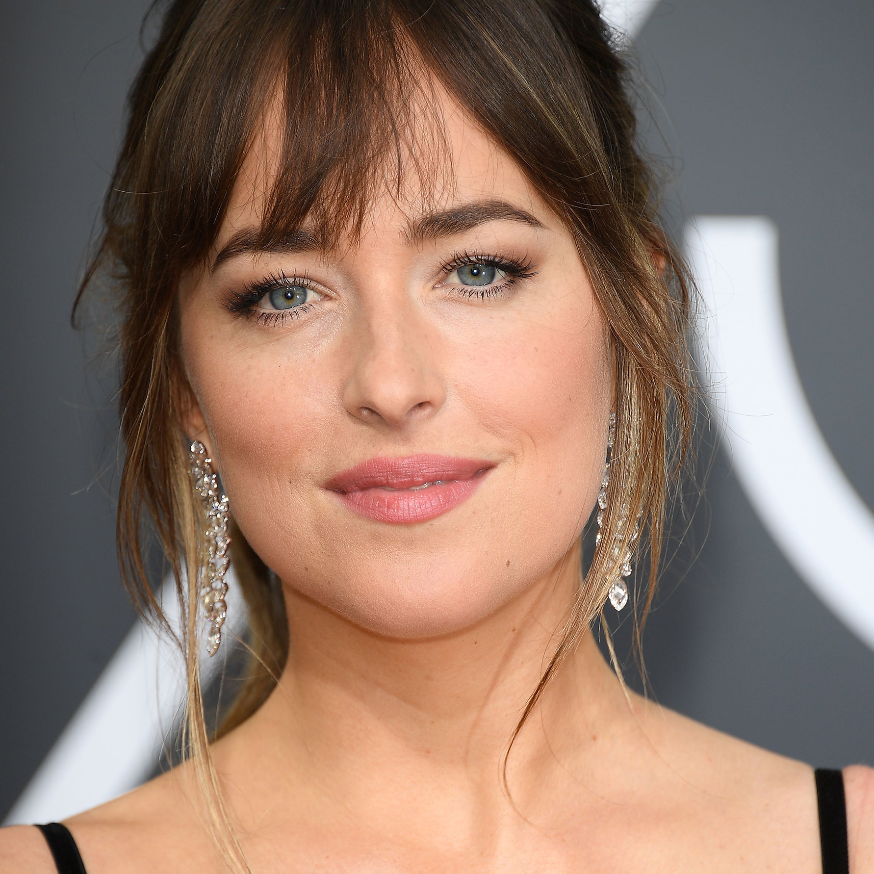 Dakota Johnson Spotted at Chris Martin’s Coldplay Concert Amid Confusing Relationship Reports