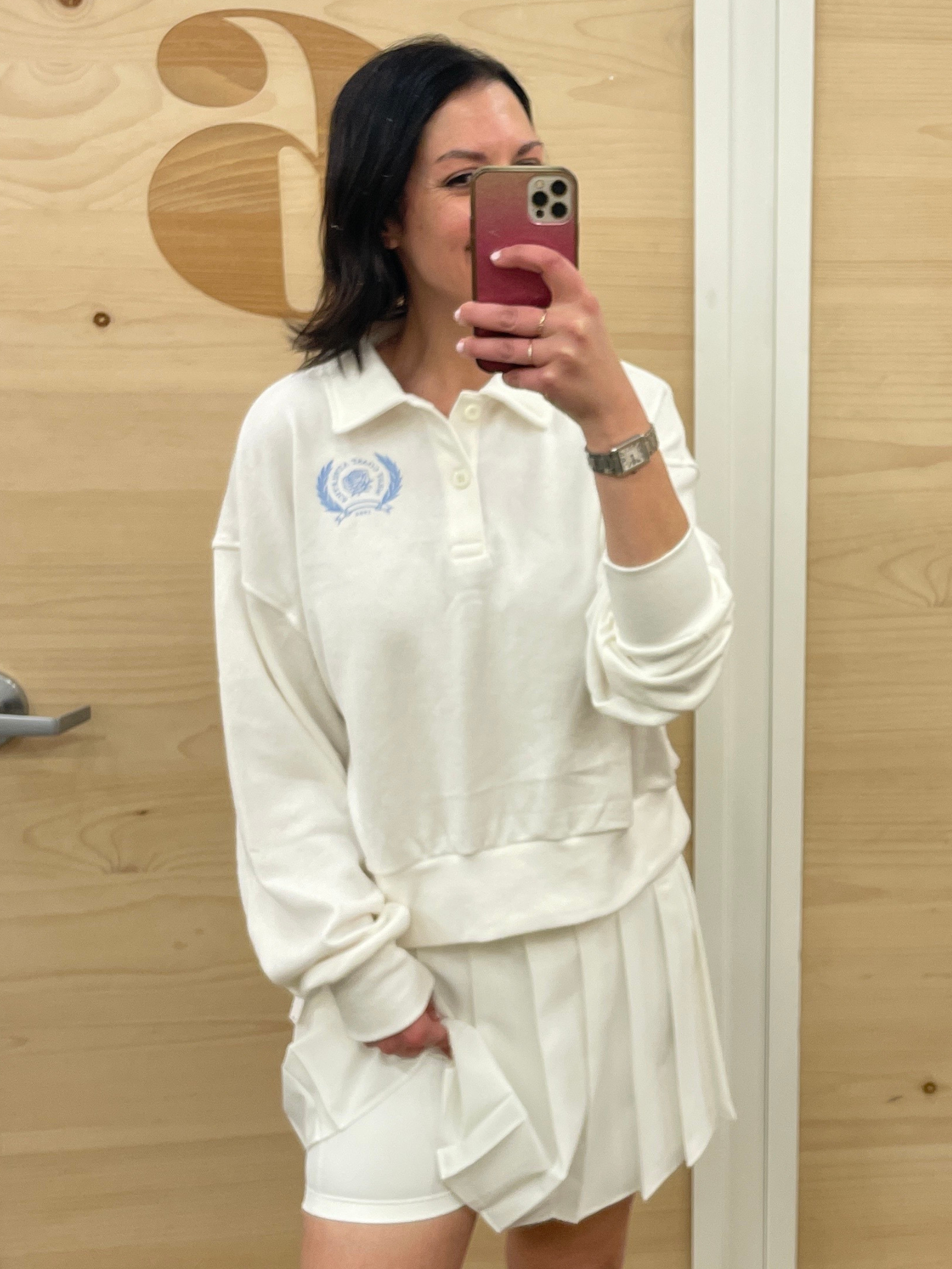 Image may contain Clothing Sleeve Blouse Face Head Person Adult Electronics Mobile Phone and Phone